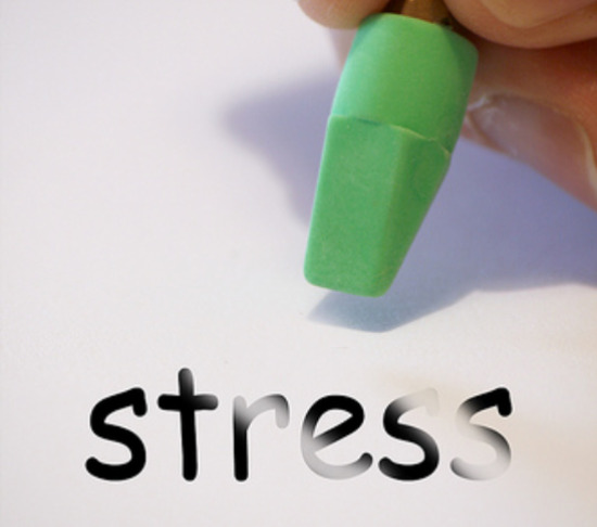 Pencil erasing the word "stress"