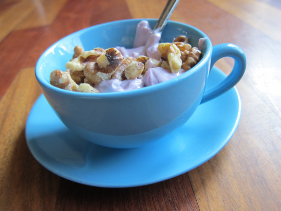 Greek yogurt in a blue cup with walnuts 1